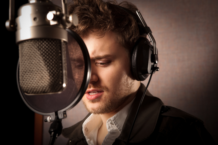 A musician or singer in the recording studio